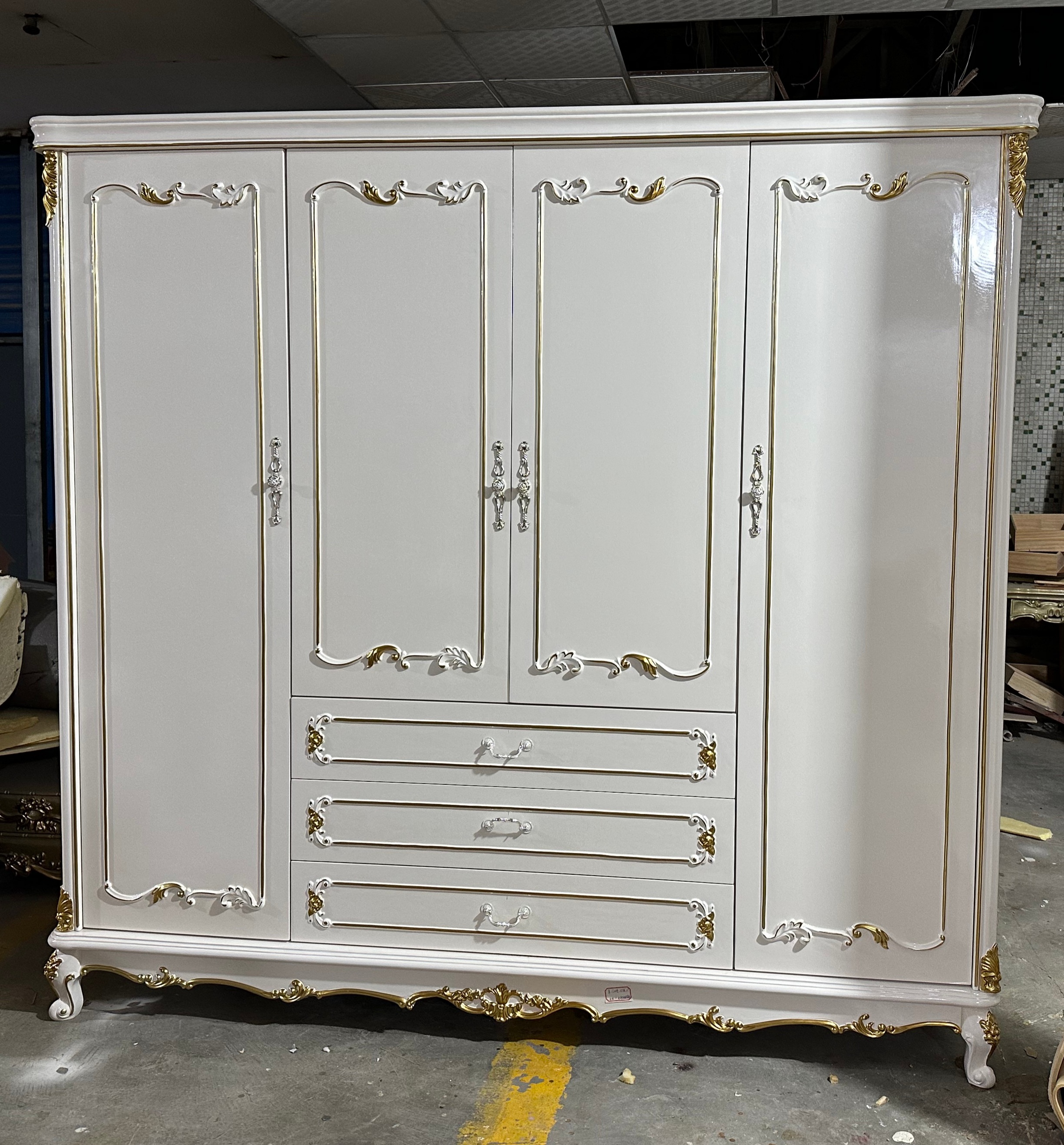 white, hairless wardrobe with four doors.