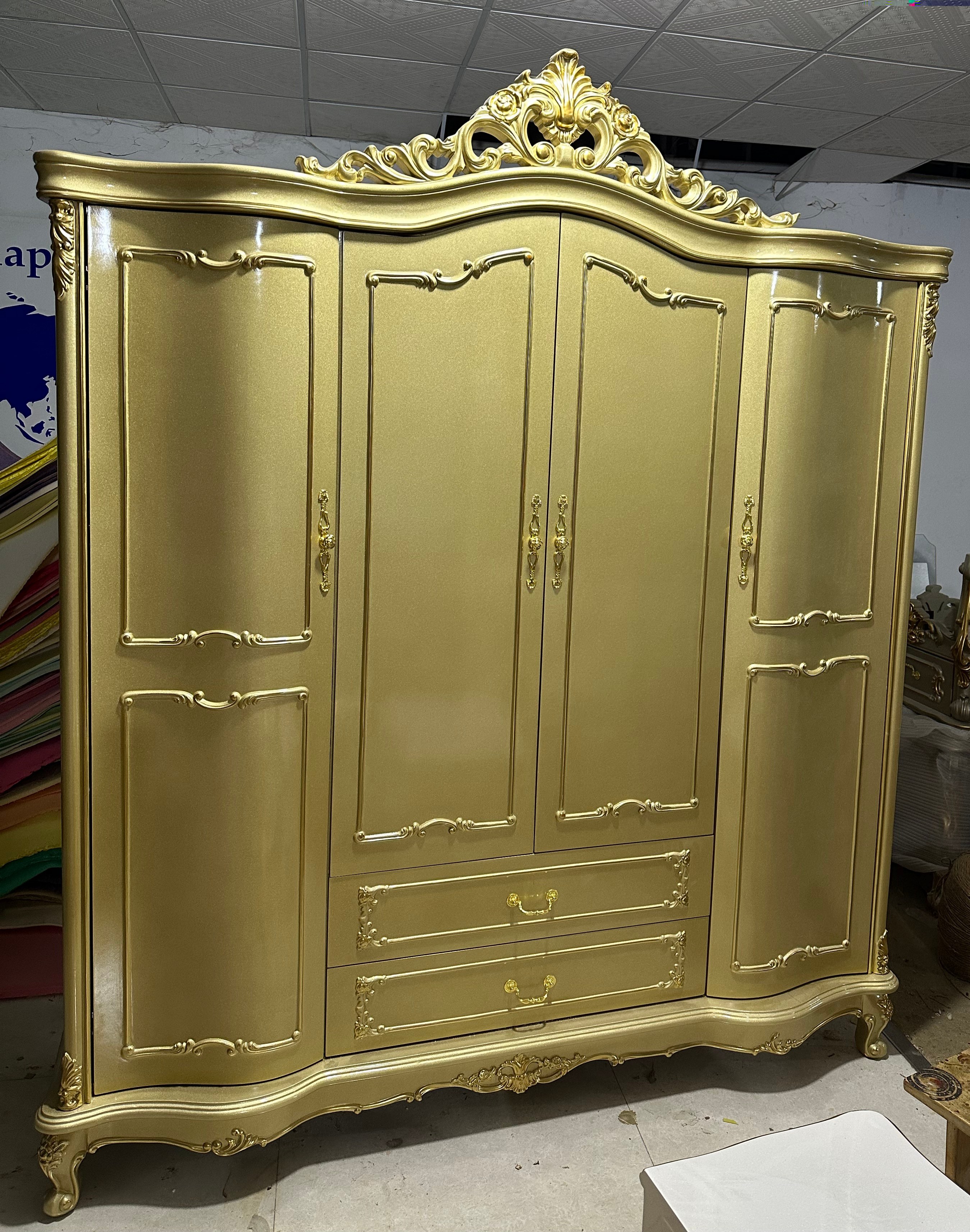 Gold wardrobe with four doors.