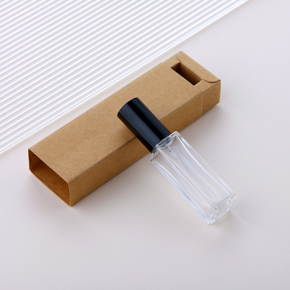Botella pulverizadora de vidrio transparente + tapa negra + caja marrón