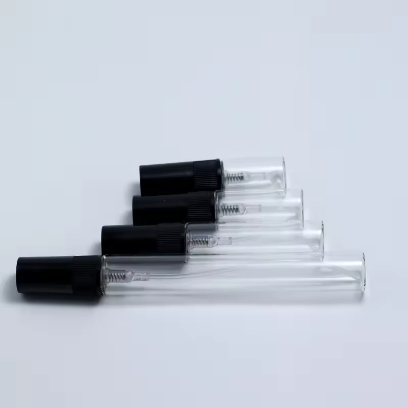 Botella transparente + Boquilla de plástico negra (rayas verticales)