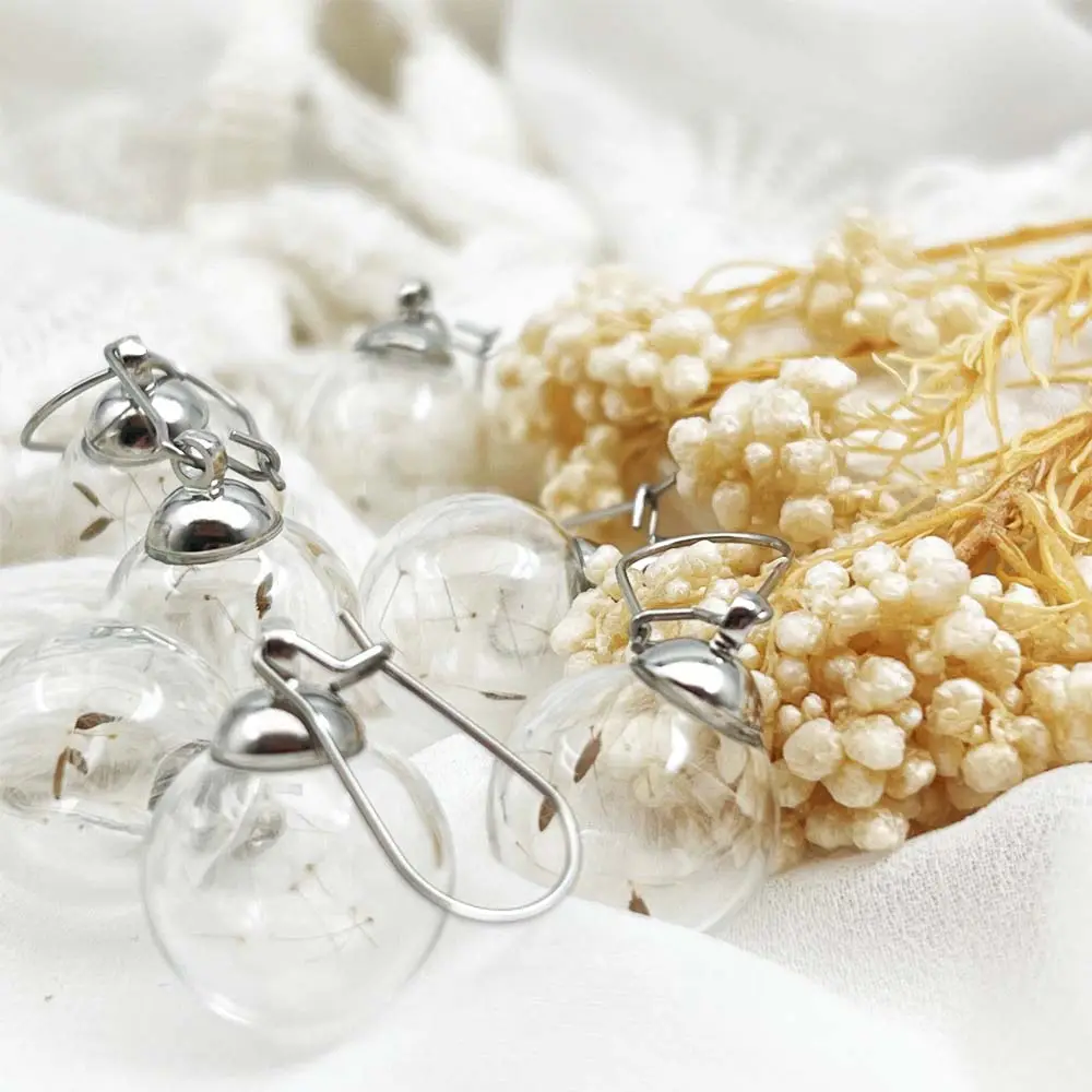 Ciondoli di gioielli veri fiori conservati per realizzare orecchini a fiori in resina di tarassaco