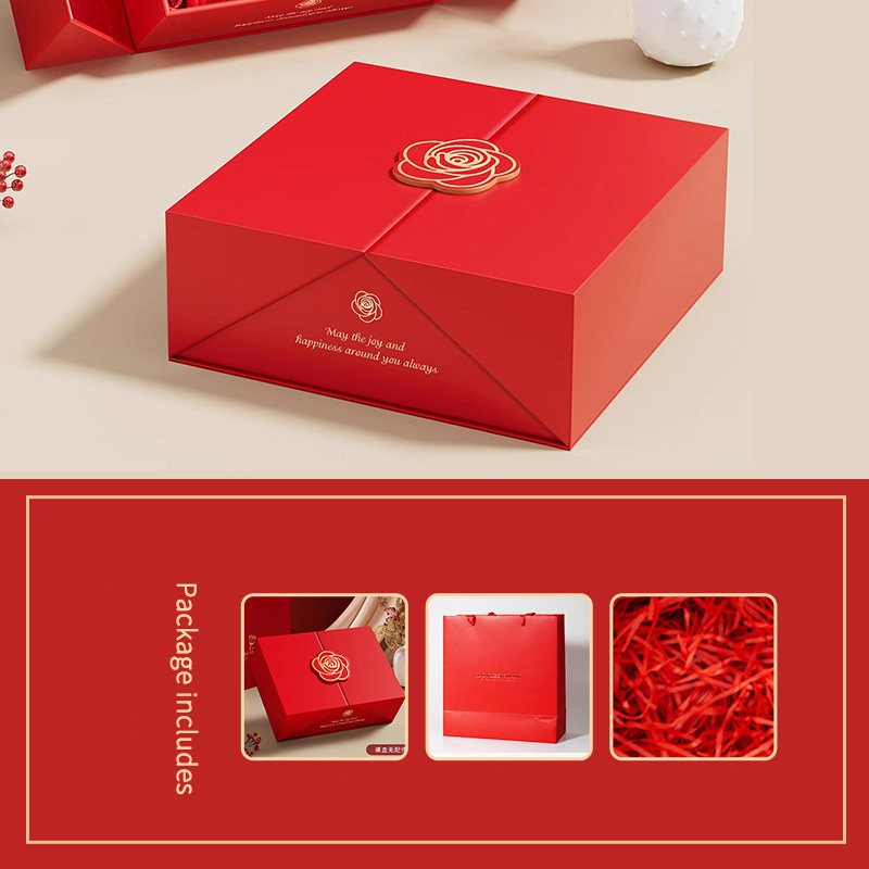 Red gift box with red gift bag and raffia