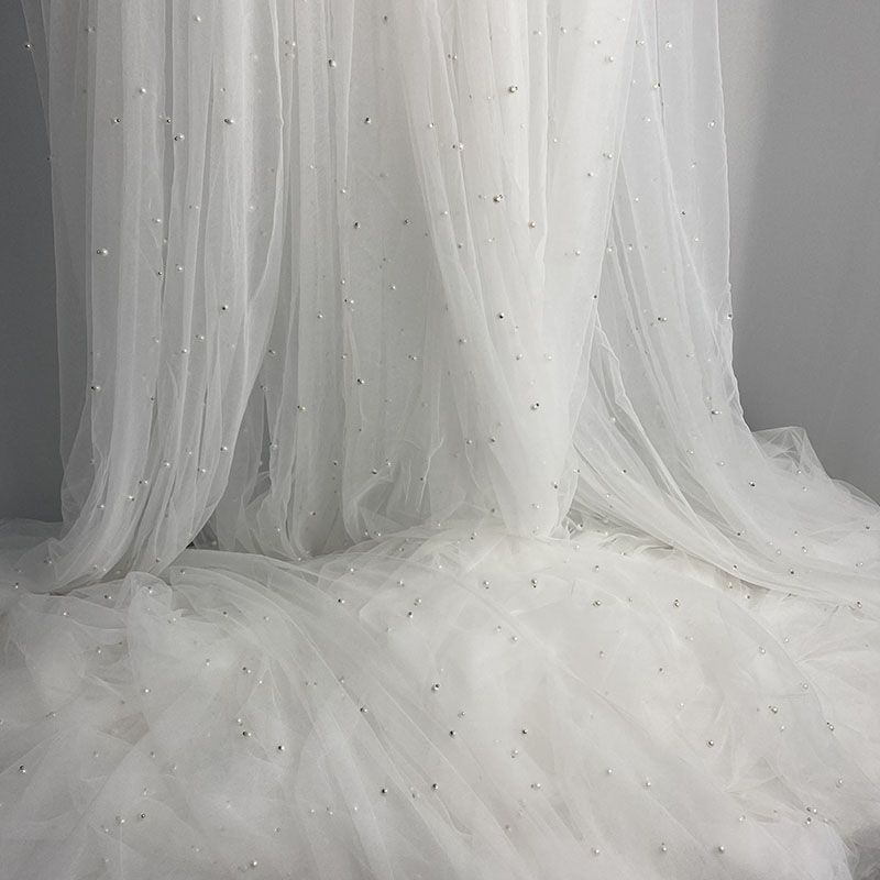 White yarn highlight white beads