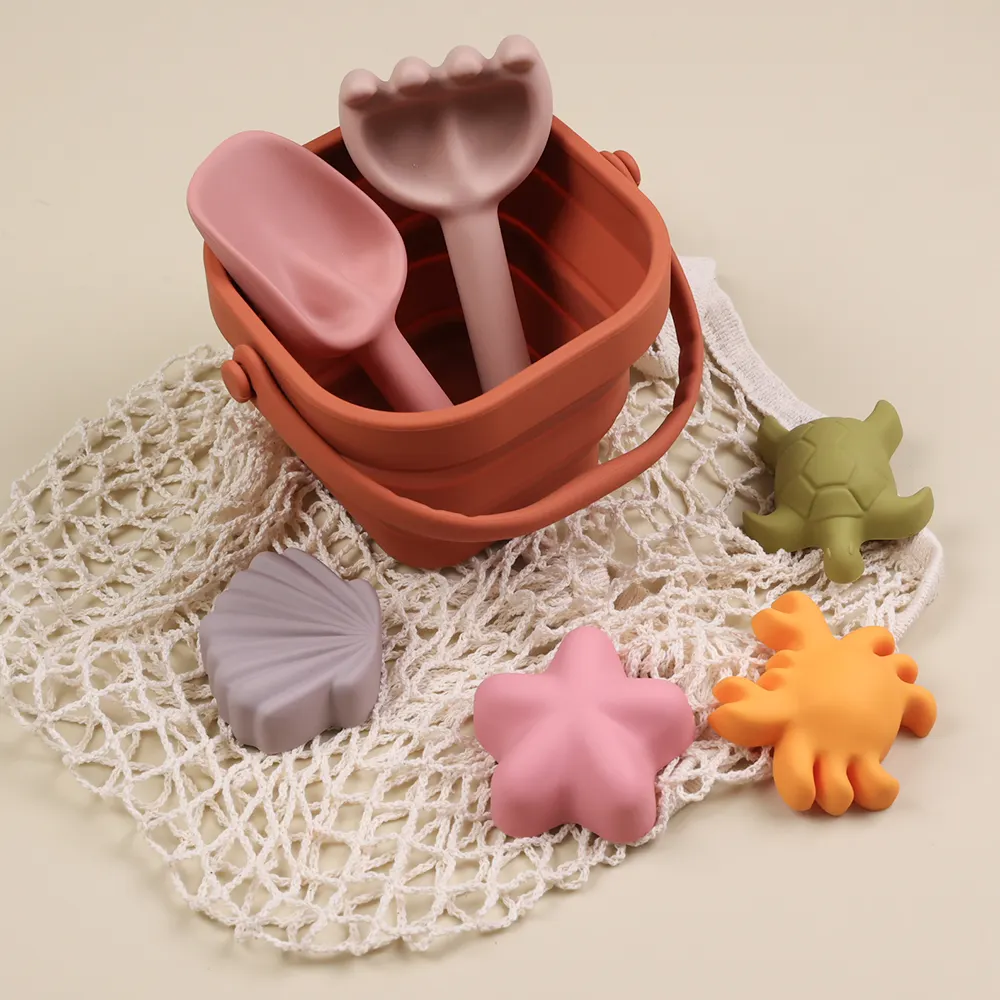 Sea Summer Toys 2024 Nuevo producto Idea Cubo plegable Palas de arena Juego de juguetes para niños Juguetes de playa de silicona ecológicos con bolsa