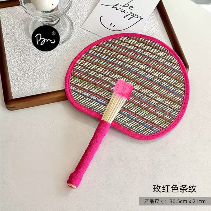 Red woven palm leaf fan
