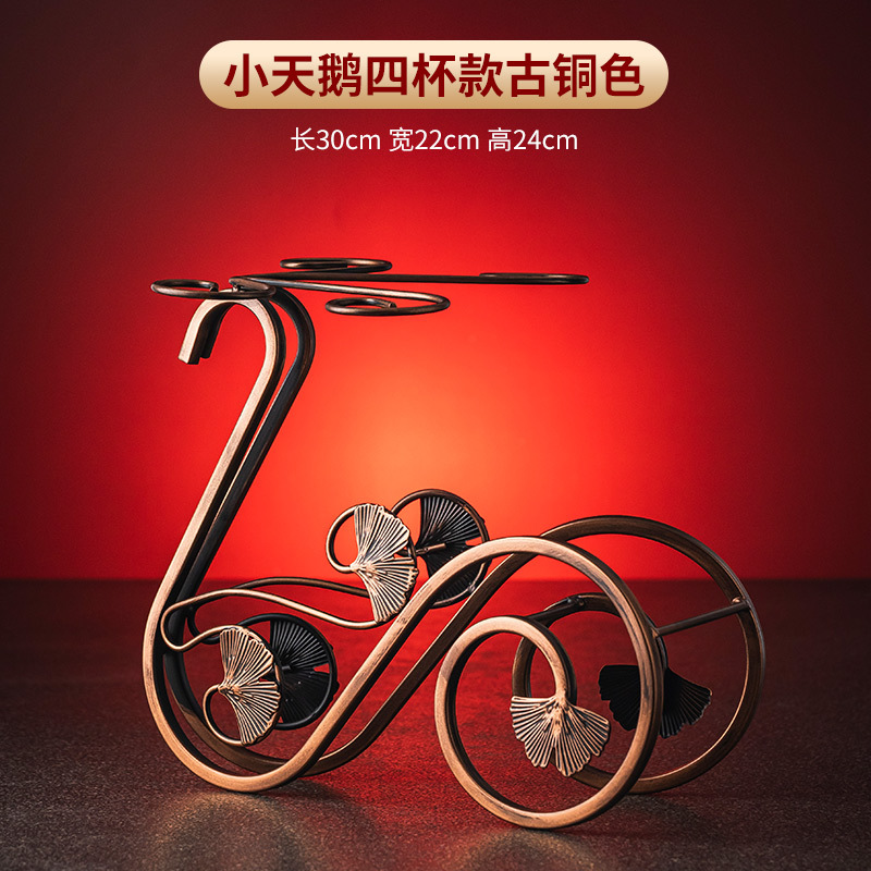 Versión de bronce de cuatro tazas Little Swan