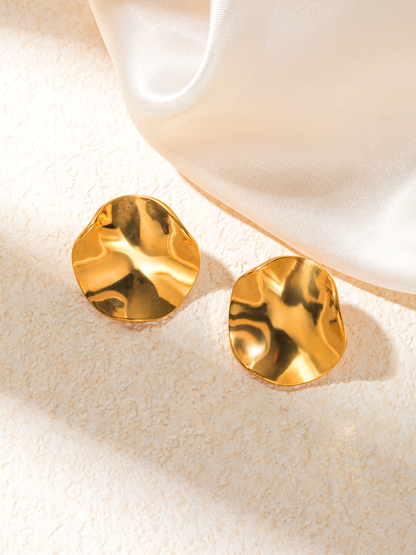 Boucles d'oreilles circulaires ondulées