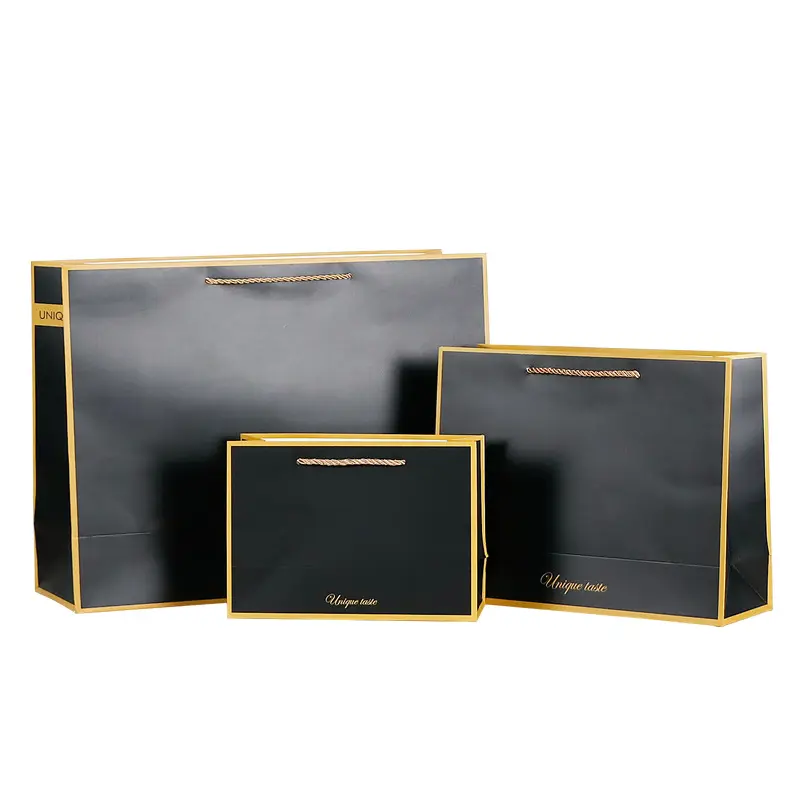 Bolsa de papel de regalo de compras de lujo negra impresa personalizada al por mayor con asa con su propio logotipo con asa de cinta