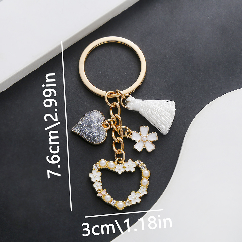 1 drop-oil white hollow heart keychain-er729-1123g