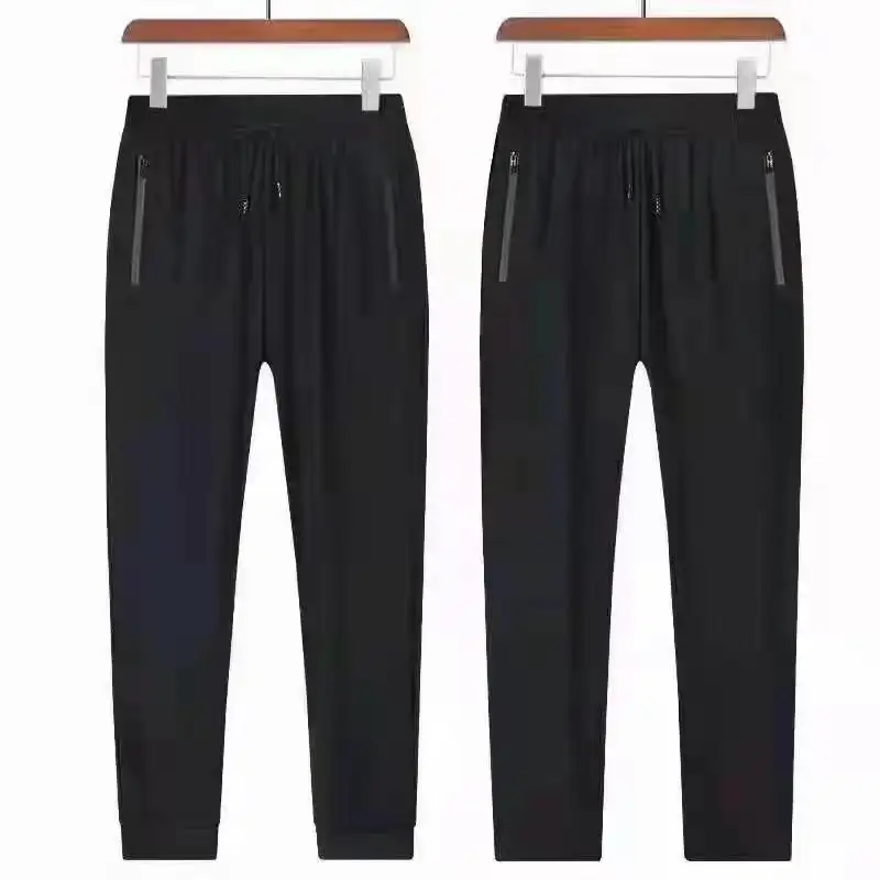 Pantalones de chándal para correr de algodón y poliéster a la moda para hombre con bolsillo lateral de punto costilla tobillo puño cordón