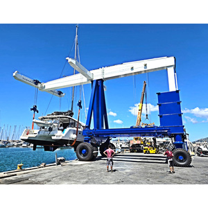 Gru a cavalletto per pneumatici in gomma resistente per impilamento di <span class=keywords><strong>Container</strong></span> portuali e sollevamento di barche 50T 100 Ton capacità di sollevamento ibrido Diesel