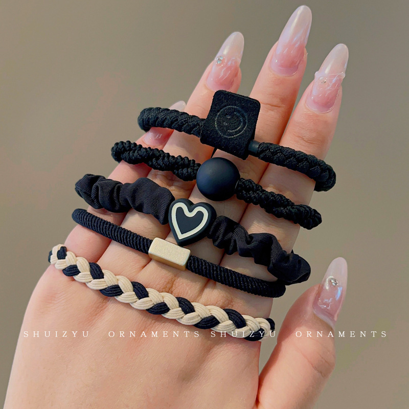 Set da 5 elastici per capelli neri.