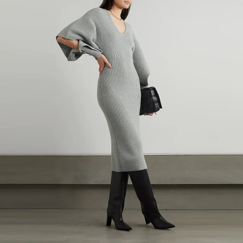 Gaun rajut lengan tidak beraturan kerah V wanita, gaun rajut pinggang ramping kepribadian sederhana musim gugur 2023 produk baru