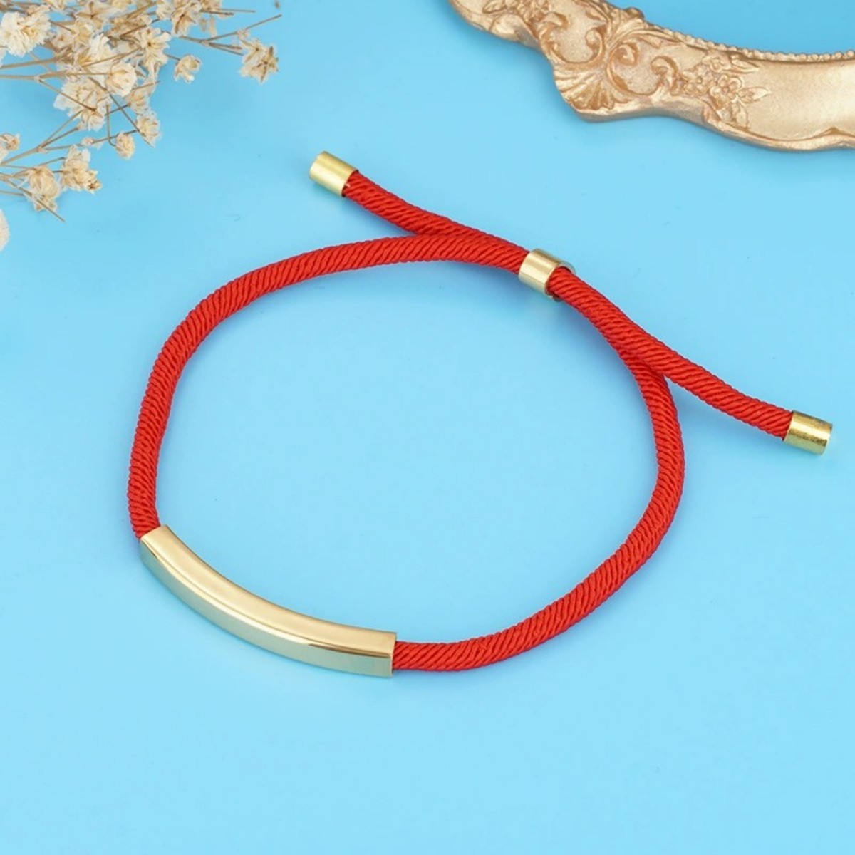 Ciondolo in oro+cordone rosso