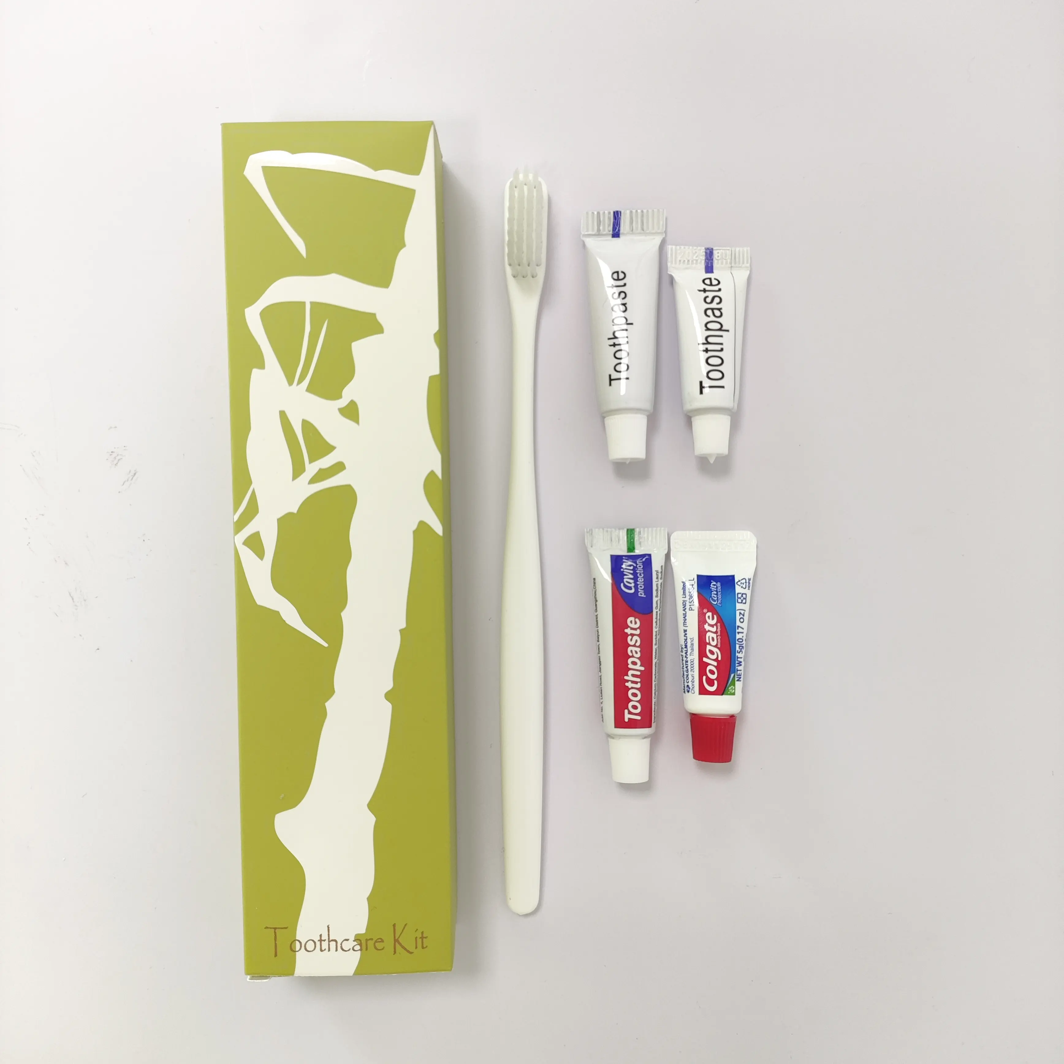 2024 singolarmente verde scatola di imballaggio Kit dentale di plastica spazzolino da denti con dentifricio all'interno per la cura orale