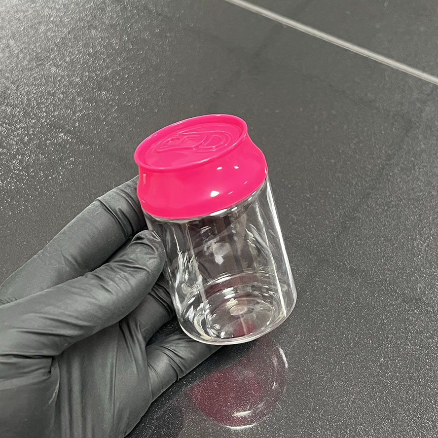 Botella transparente con tapa rosa