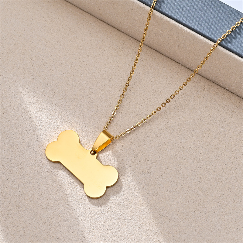 Pendentif chaîne 04X50, os de chien 1,5X3,0, doré.