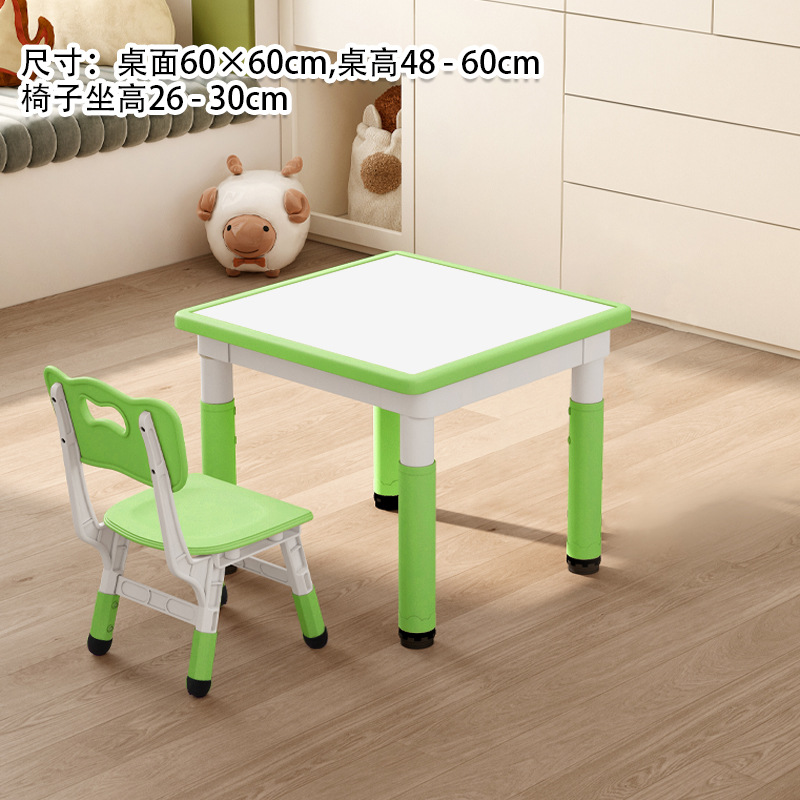 Una mesa y silla de color verde pizarra blanca.