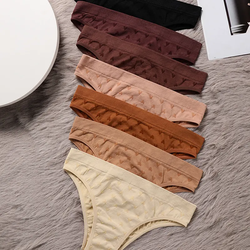 Sous-vêtements sans couture à imprimé cœur d'amour avec logo personnalisé à haute élasticité et taille basse Tanga Sin Costuras String sans couture Tanga pour dames