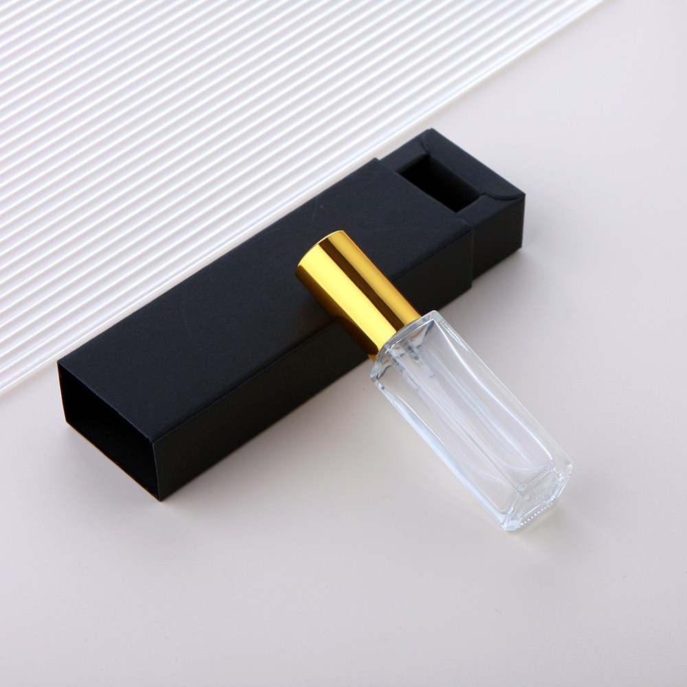Botella pulverizadora de vidrio transparente + tapa dorada + caja negra