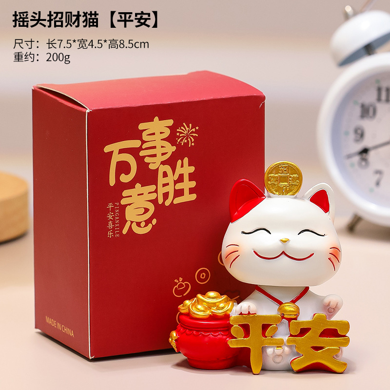 Bobbing lucky cat (symbolizing peace)