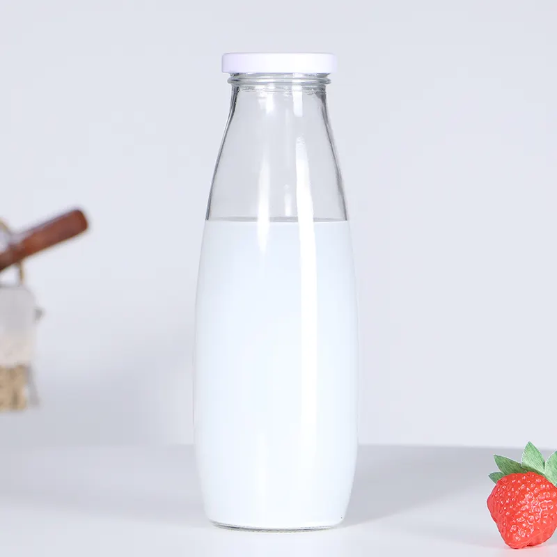 Bouteilles de lait en verre de jus de boisson de qualité alimentaire de l'industrie de la boisson en gros 1l avec couvercle