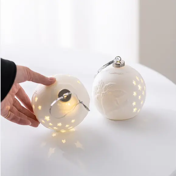 Nouveau design de décoration de fête de Noël avec petite cloche en céramique éclairée par LED