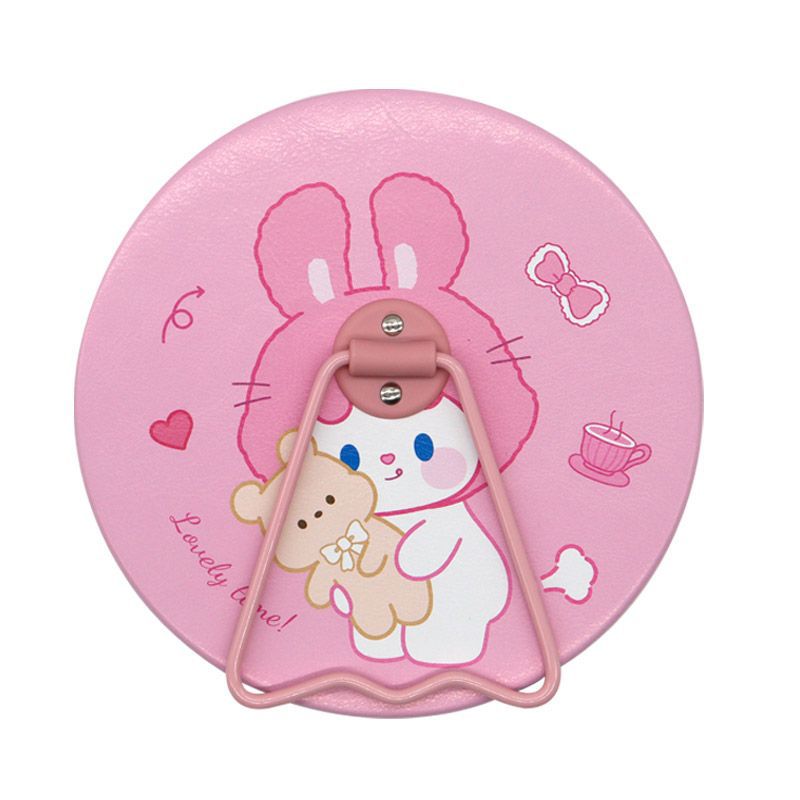 Table ronde miroir rose avec motif petit ours lapin.