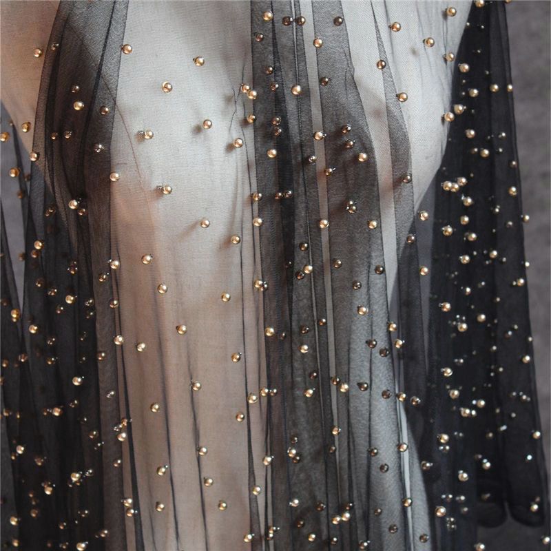 Black yarn highlight gold beads
