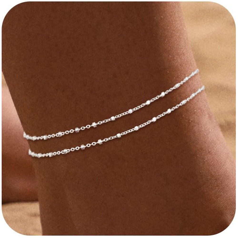 Perles de millet argentées à double couche