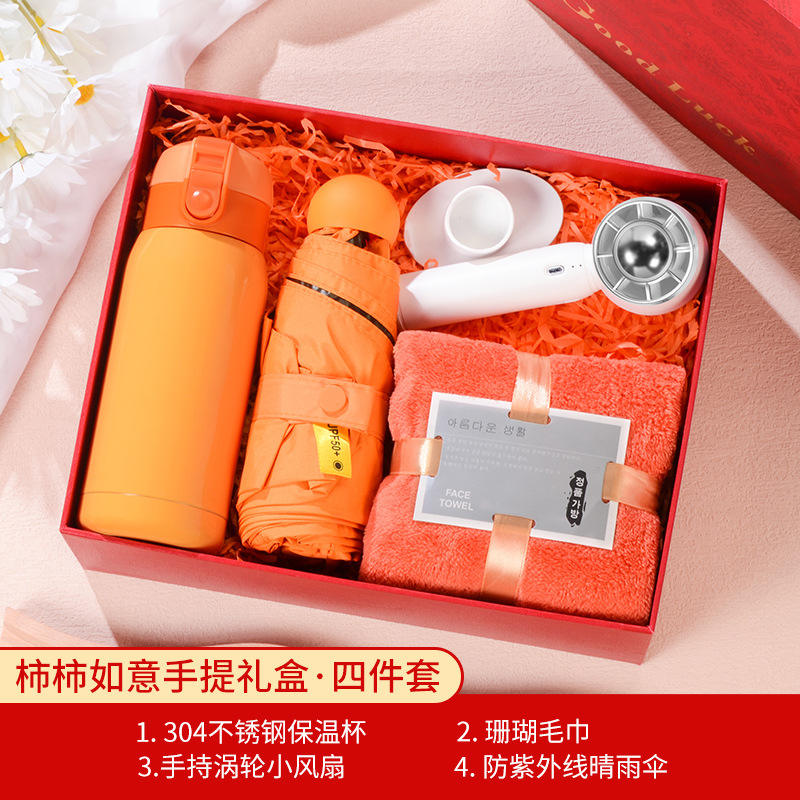 Coffret cadeau : Tasse rebondissante orange, ventilateur vortex, parapluie, serviette.