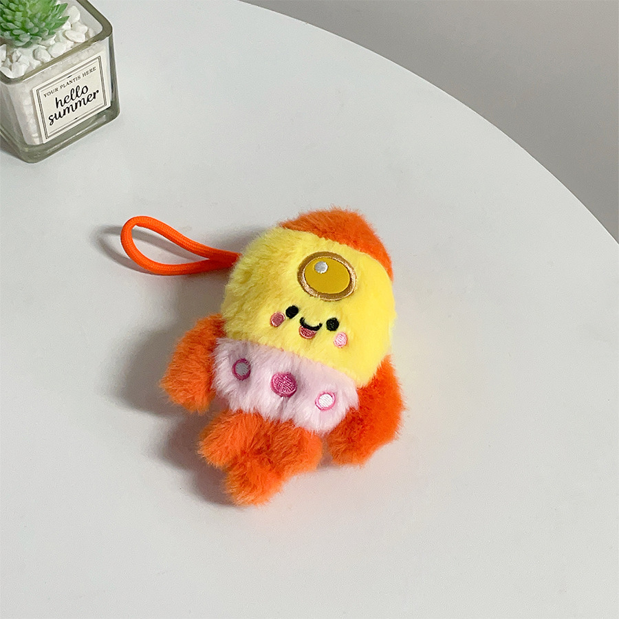 Orange-yellow-pink patchwork rocket pendant