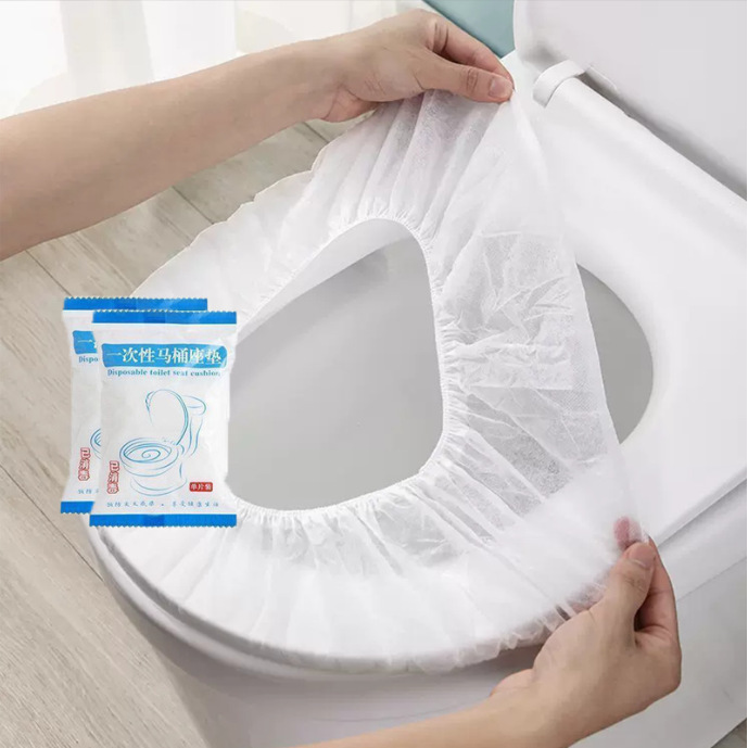 White toilet seat cover, individually packaged.
