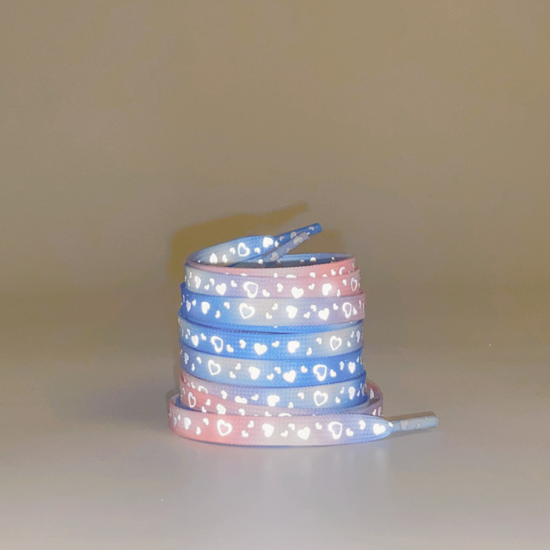 A pair of blue powder reflective love shoelaces