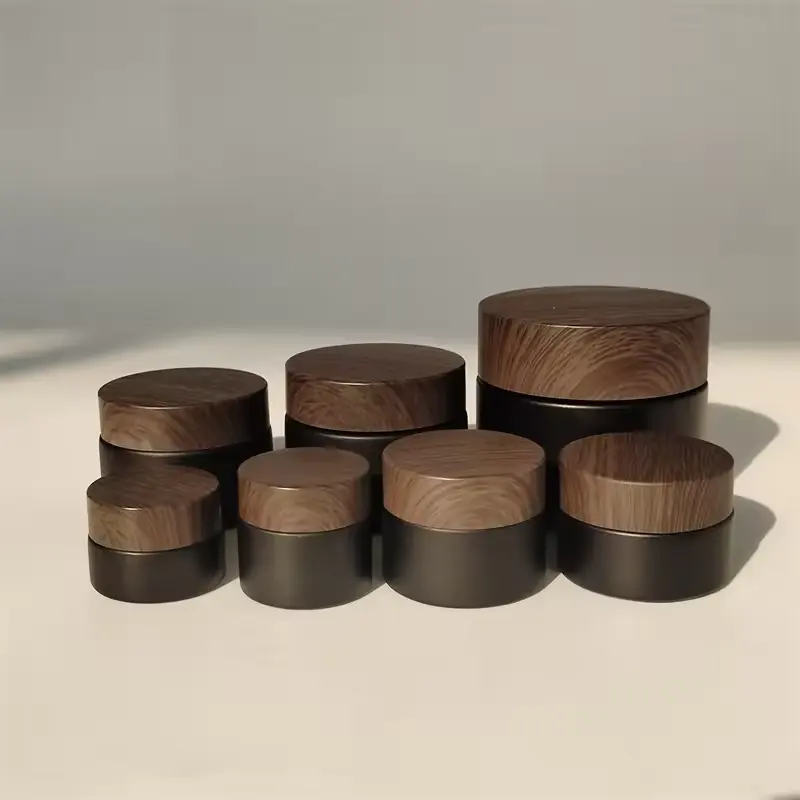 In Stock Wholesale 5/10/15/20/30/50G Matte Black Face Cream Jar Containers 1 2 4 Oz Glass Jars With Plastic Wood Grain Lid
