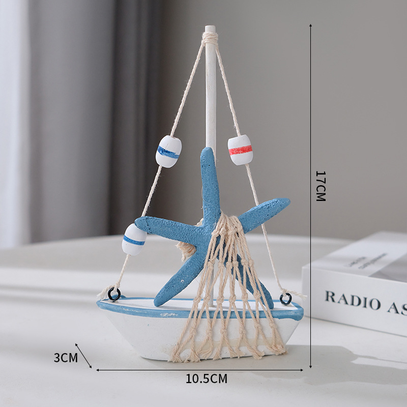 Étoile de mer colorée en forme de voilier perlé de 17 centimètres.