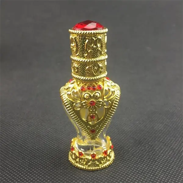 Magnifique mini bouteille de parfums en verre doré arabe