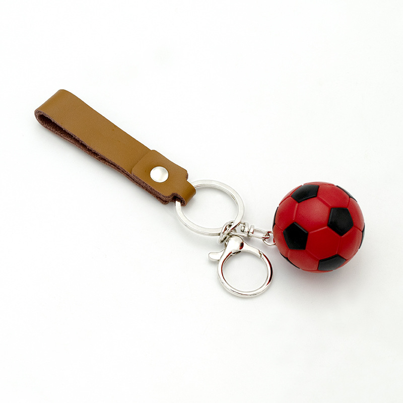 Fútbol de puntos rojos y negros.