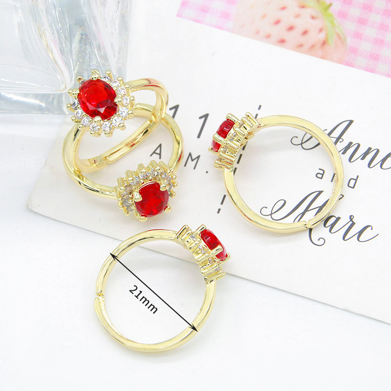 2. Red oval zircon set with diamonds