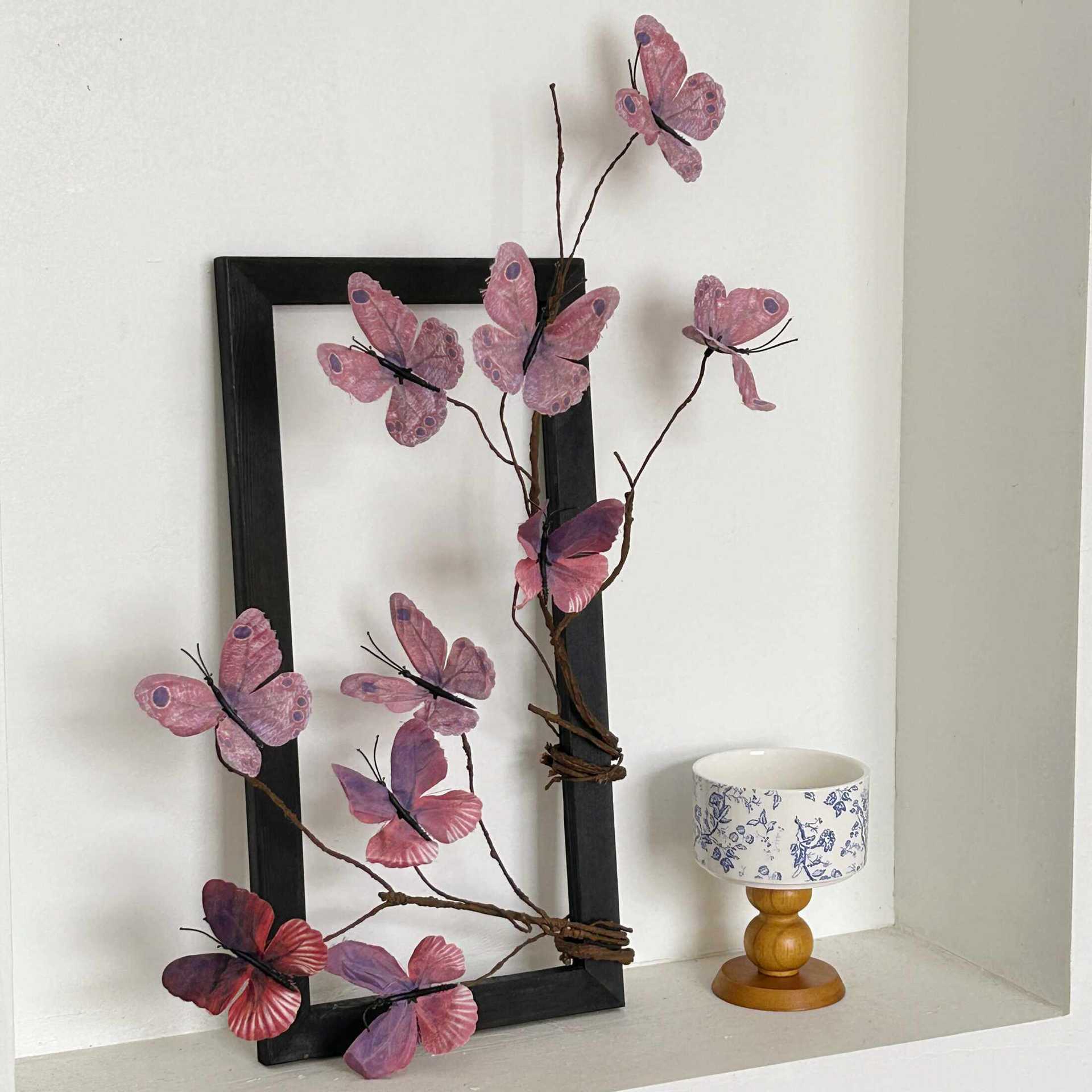 Two purple butterflies in the picture frame
