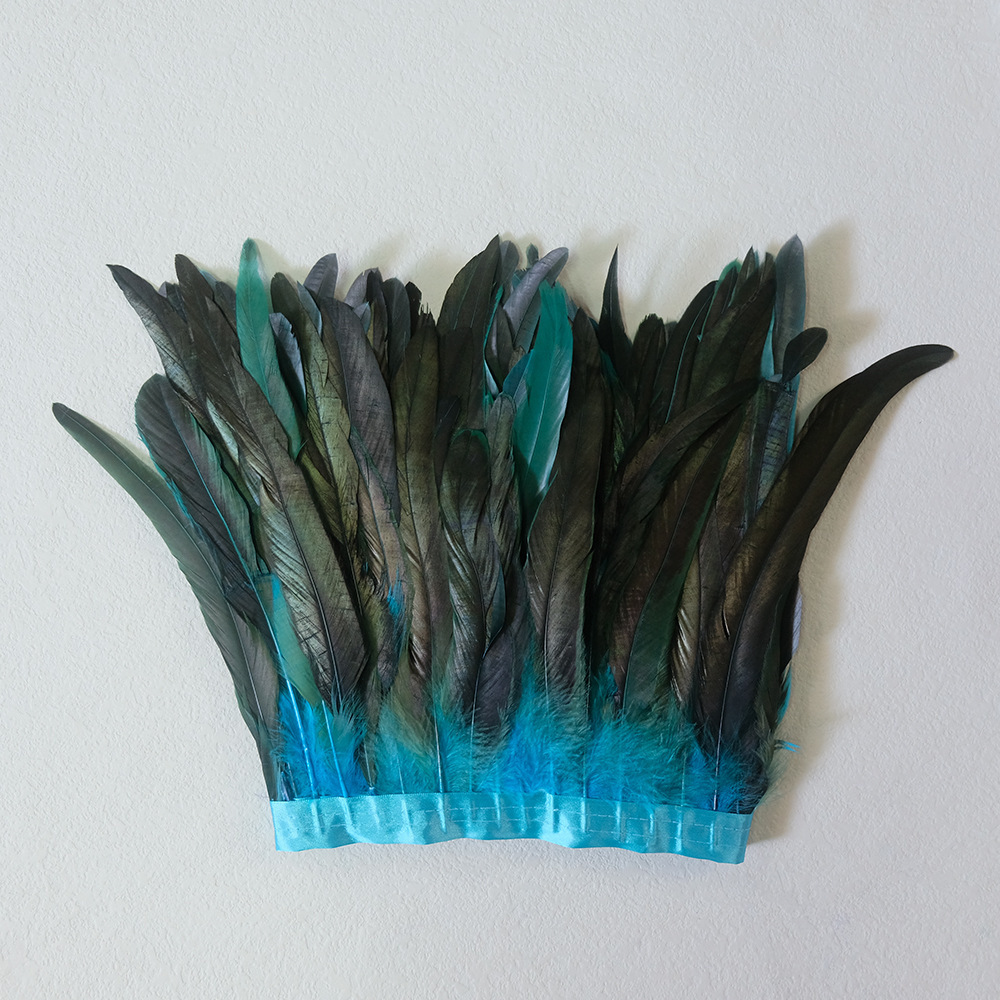Finges de plumes de coq turquoise