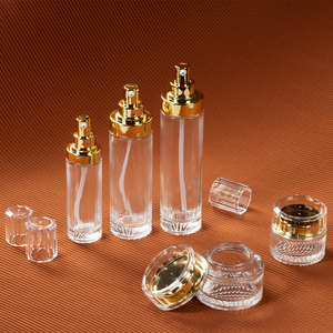 Conjunto de embalagens de vidro luxuosas e elegantes para cuidados com a pele, creme cosmético, frasco de vidro fosco para loção vazia, frasco de spray com bomba de ouro