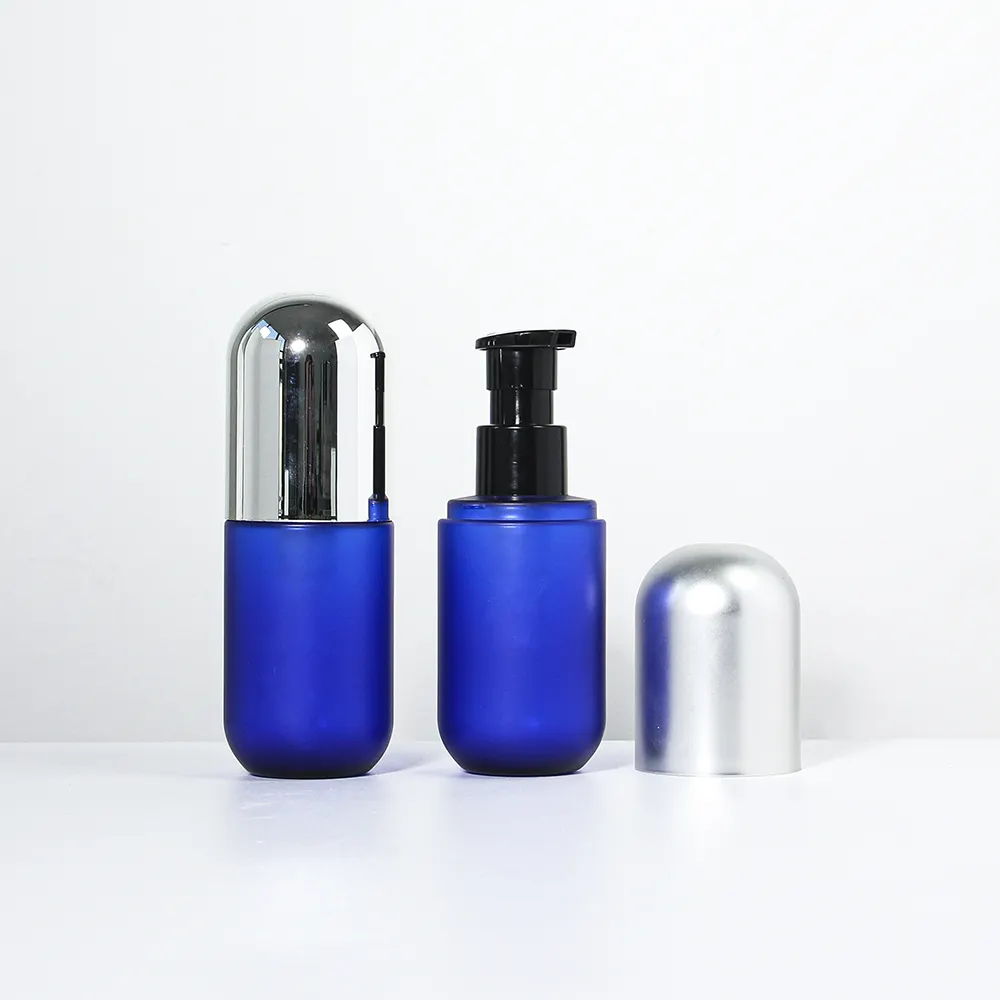 Botella de loción de plástico de nuevo diseño para embalaje personal, contenedor de pasta de dientes con forma de cápsula, botella de PET de Color azul índigo de 100ml