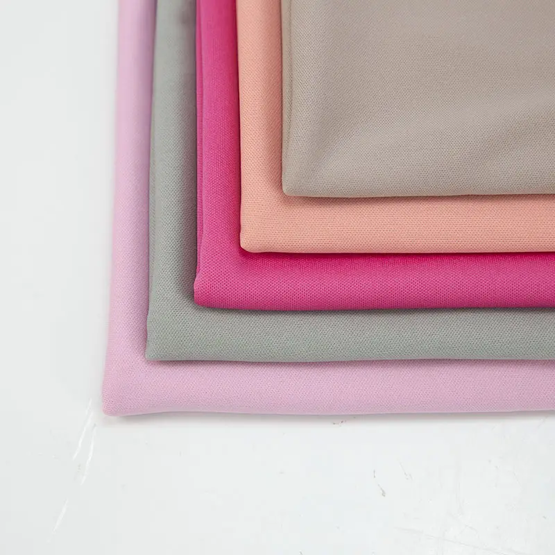 Shaoxing tekstili profesyonel tedarikçi % 100% Polyester düz kilit düz boyalı spor örgü kazak mısır astar kumaş kumaş