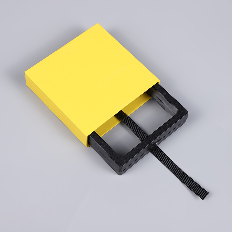 Cartón duro y grueso amarillo + caja de suspensión de PE negra