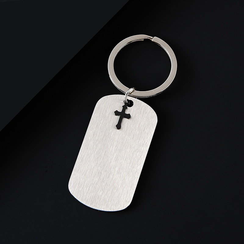 Silver key ring with black cross