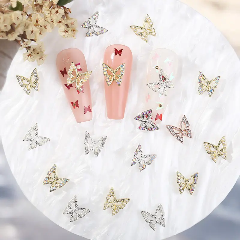 Accessoires pour ongles populaires breloques papillon argent or rose en vrac en gros strass perle métal papillon breloques pour ongles