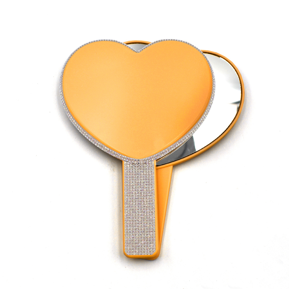 Espejo de corazón amarillo y rosa.