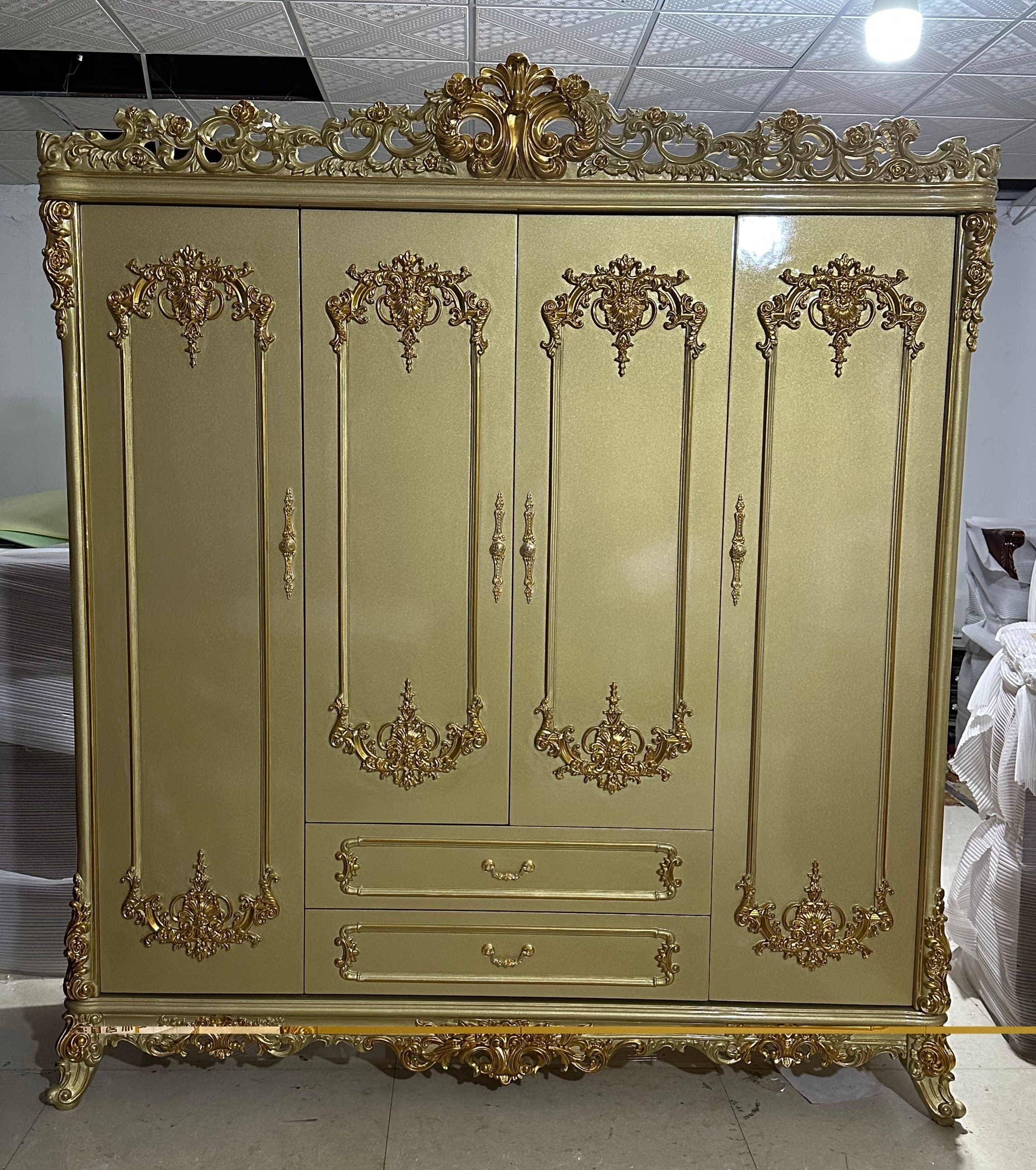 Gold wardrobe with four doors.