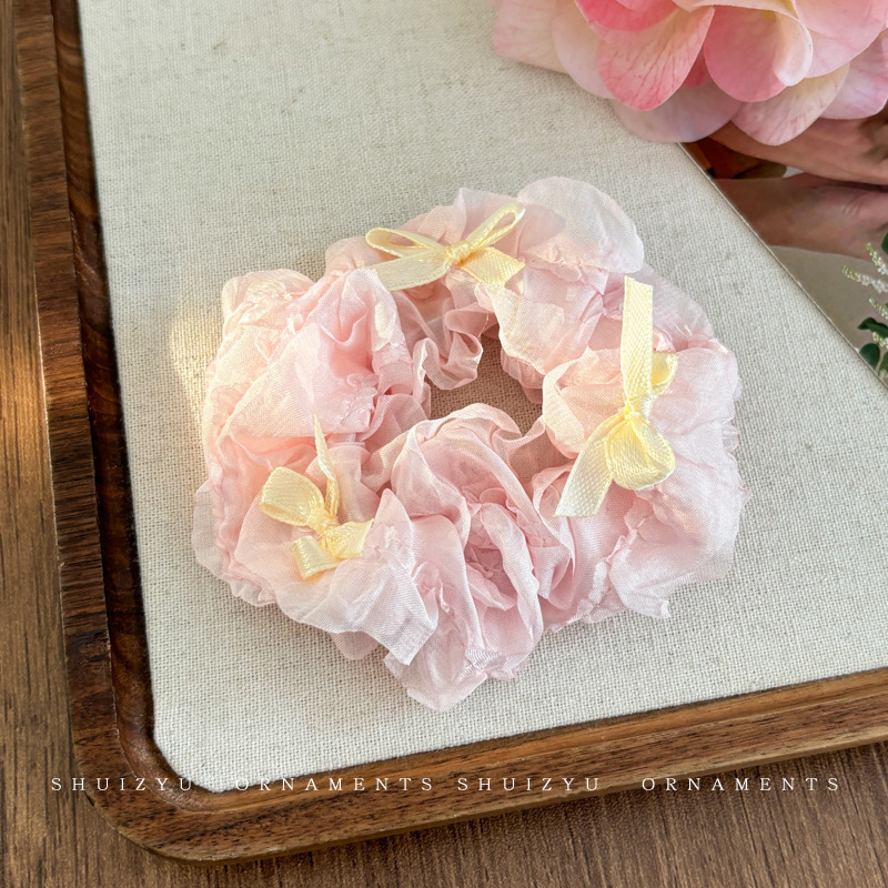 3. Milky white bow-shaped scrunchies